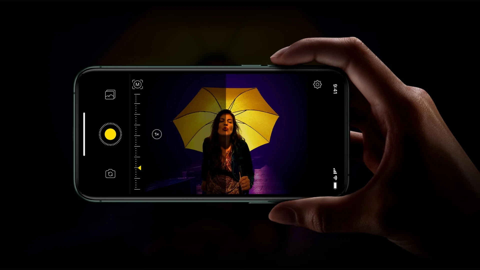 A low-light portrait with a yellow umbrella